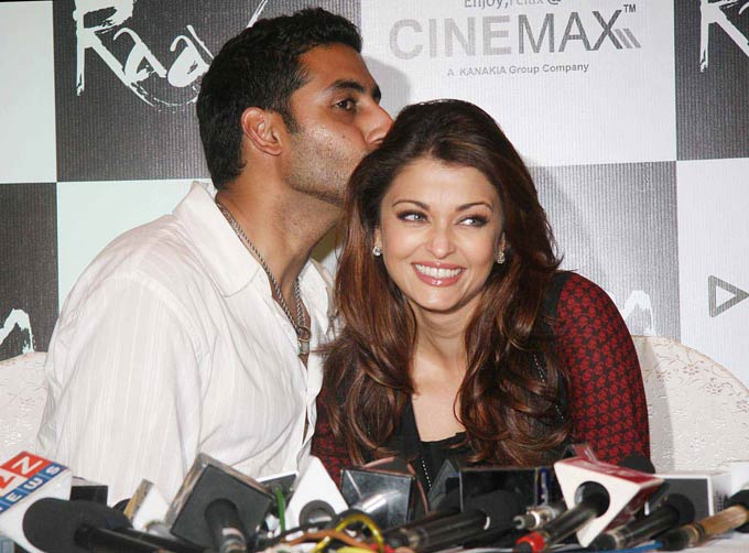 Abhishek Bachchan kisses Aishwarya Rai Bachchan at an event