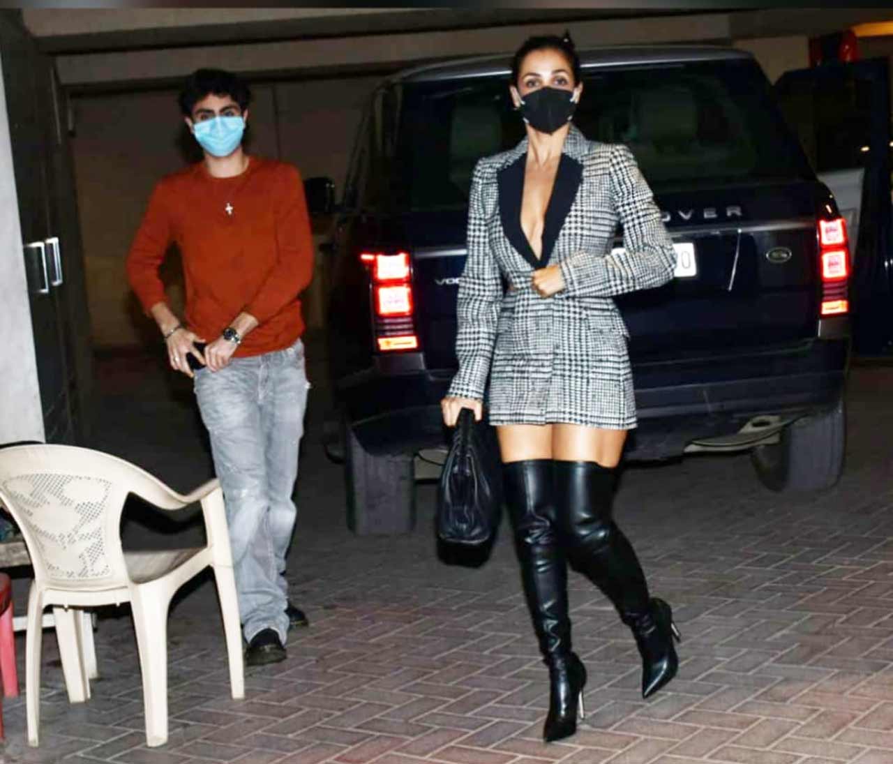Malaika Arora, along with her son Arhaan Khan and boyfriend Arjun Kapoor, were snapped at Kareena Kapoor Khan's Bandra home to attend Amrita Arora's birthday celebration. The bash was attended by Karisma Kapoor and her husband Shakeel Ladak and the kids too!