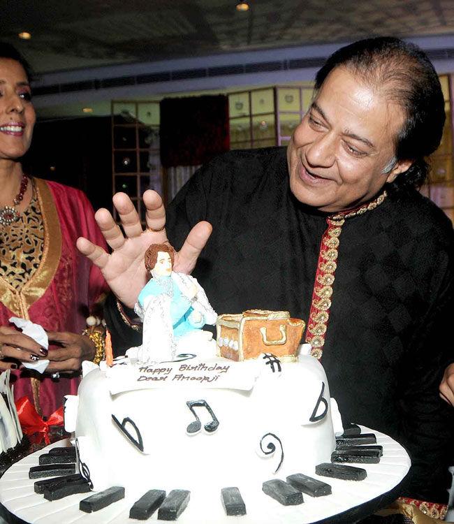 Anup Jalota poses with his birthday cake