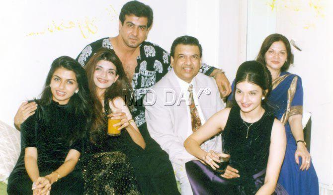 Bhagyashree and a young Ronit Roy (third from right) pose for pictures with other guests at a party.