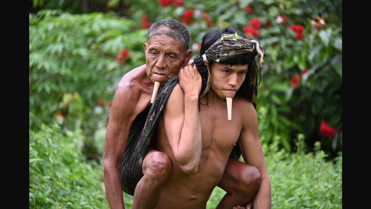 See Pic: Indigenous man carries father on his back to Covid-19 vaccination centre in Brazil