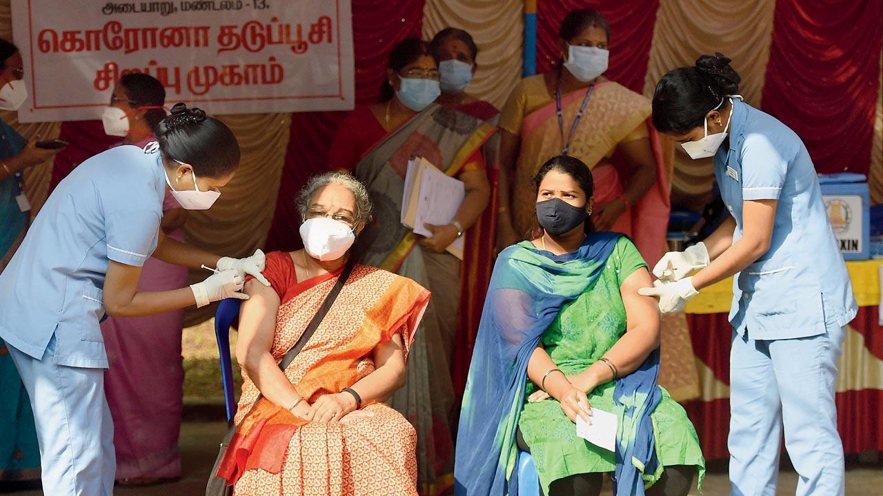 Health workers administer vaccine doses at the IIT-Madras campus, in Chennai. Pic/PTI