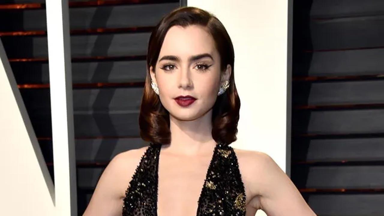 Lily Collins reacts to graffiti on poster of 'Emily in Paris'