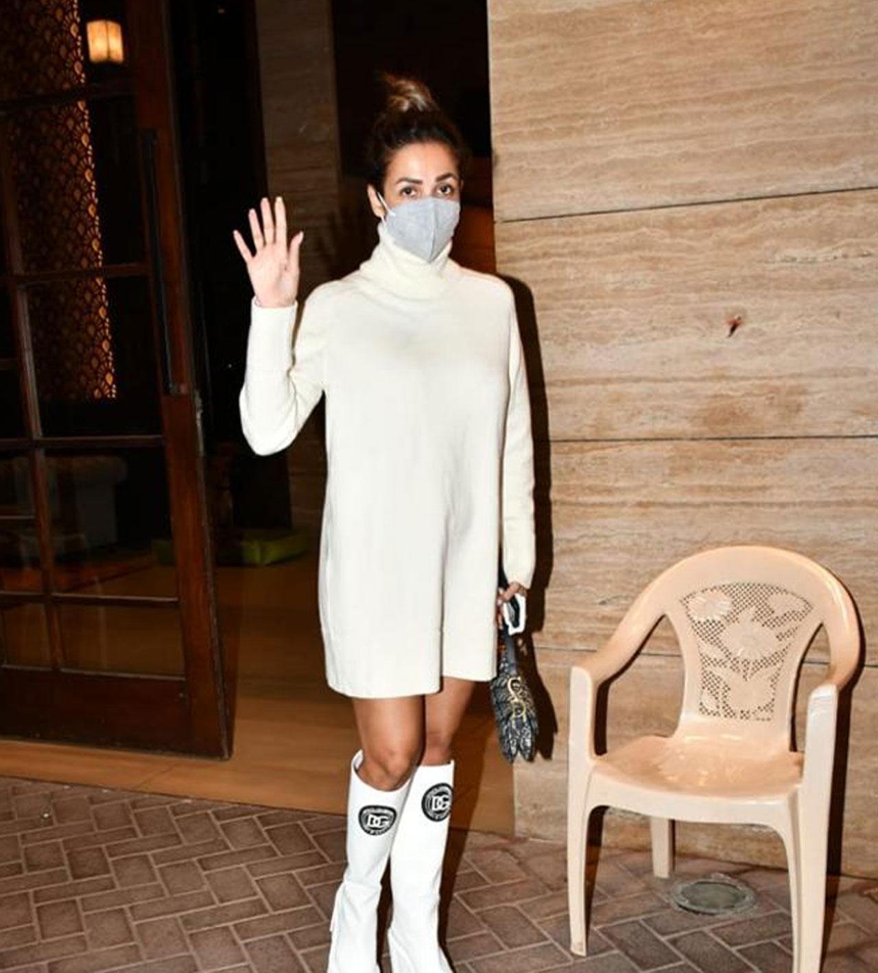 Malaika Arora looked ravishing as always in a stunning white overlong sweater and carried it with Dolce & Gabbana boots.  Malaika Arora looked ravishing as always in a stunning white overlong sweater and carried it with Dolce & Gabbana boots. 
