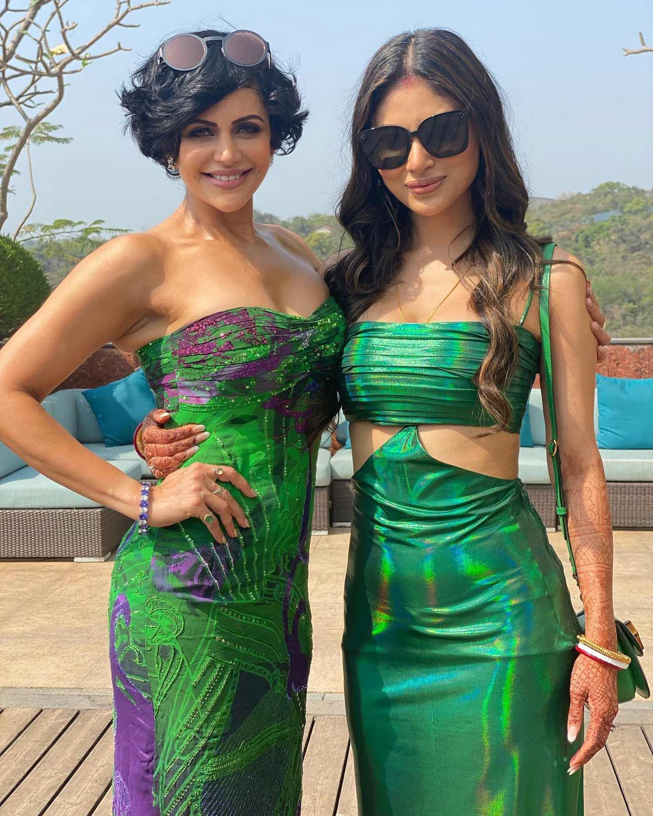 For the goa-style pool brunch, the new bride for a shiny green full-length dress, paired with shades and sindoor. Suraj wore a breezy blue-and-white shirt and trousers.