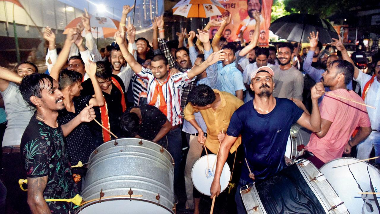 Supporters break into a celebration outside the new CM’s home at Thane on Thursday. Pic/Sameer Markande
