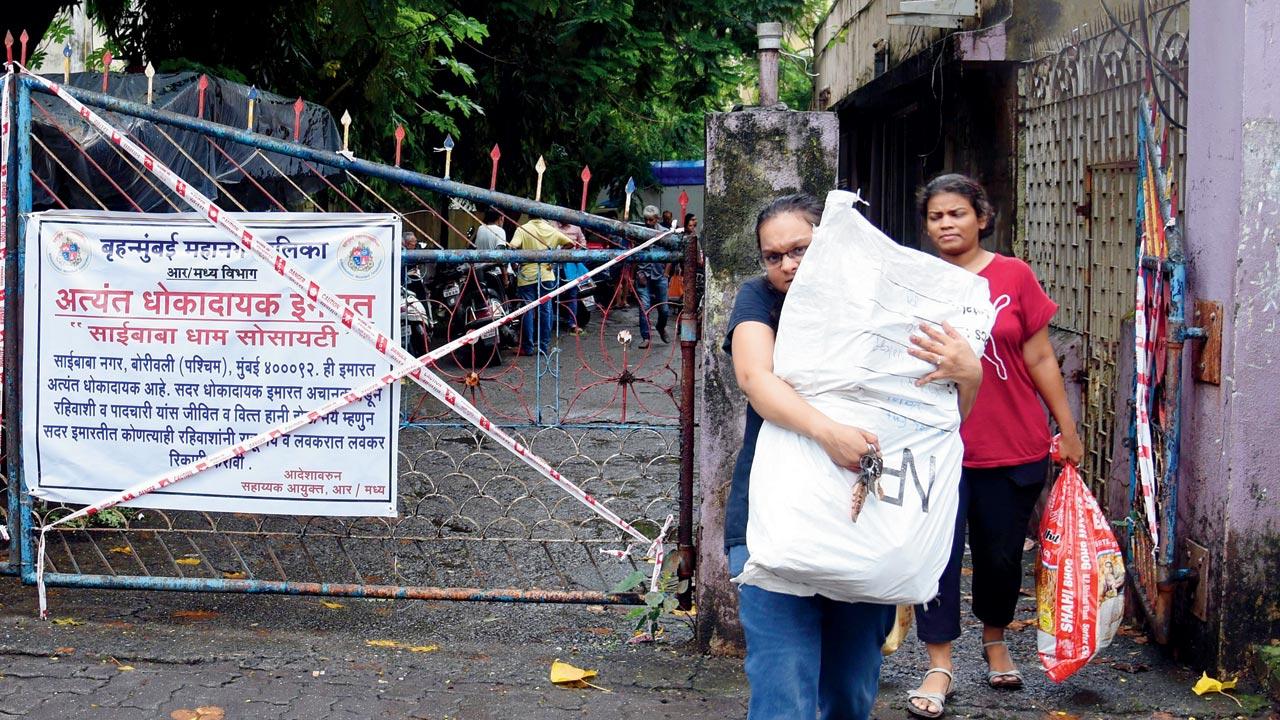 Residents vacate the housing complex