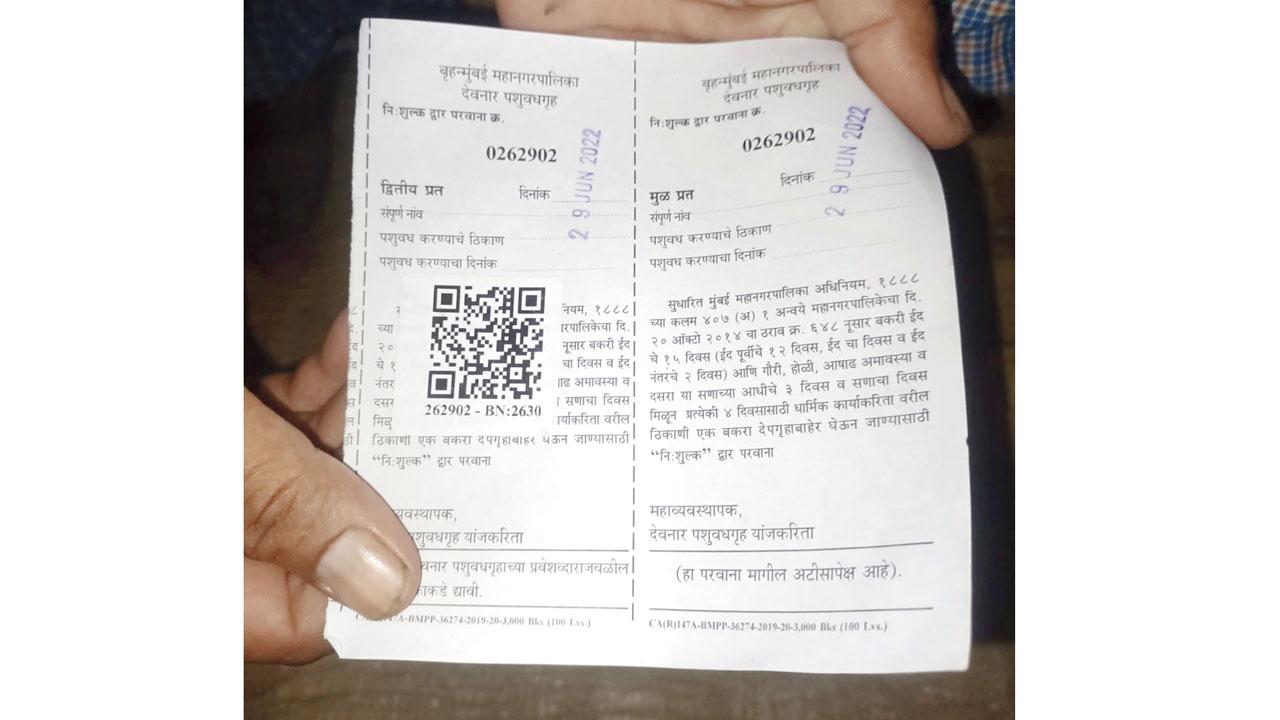 A buyer shows a receipt with a QR code at Deonar abattoir