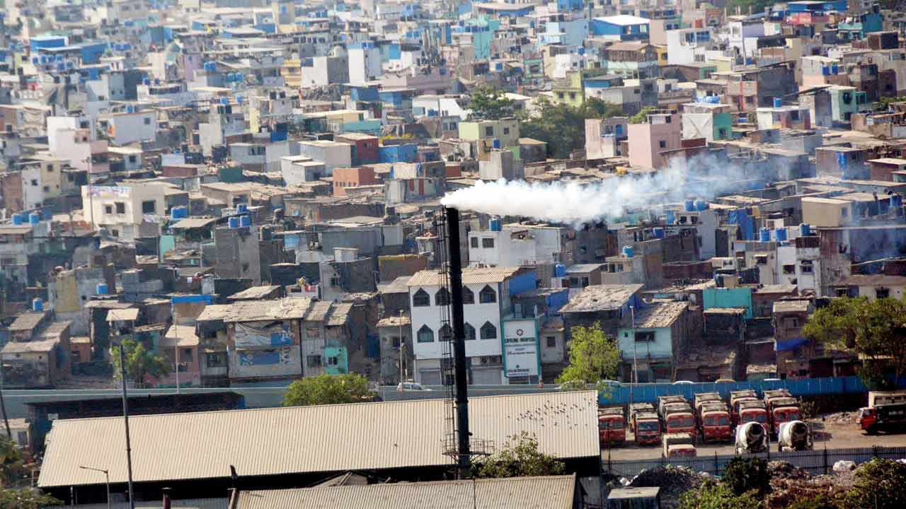 Smoke emits from a chimney of medical waste plant Envoclean, at Govandi. File pic