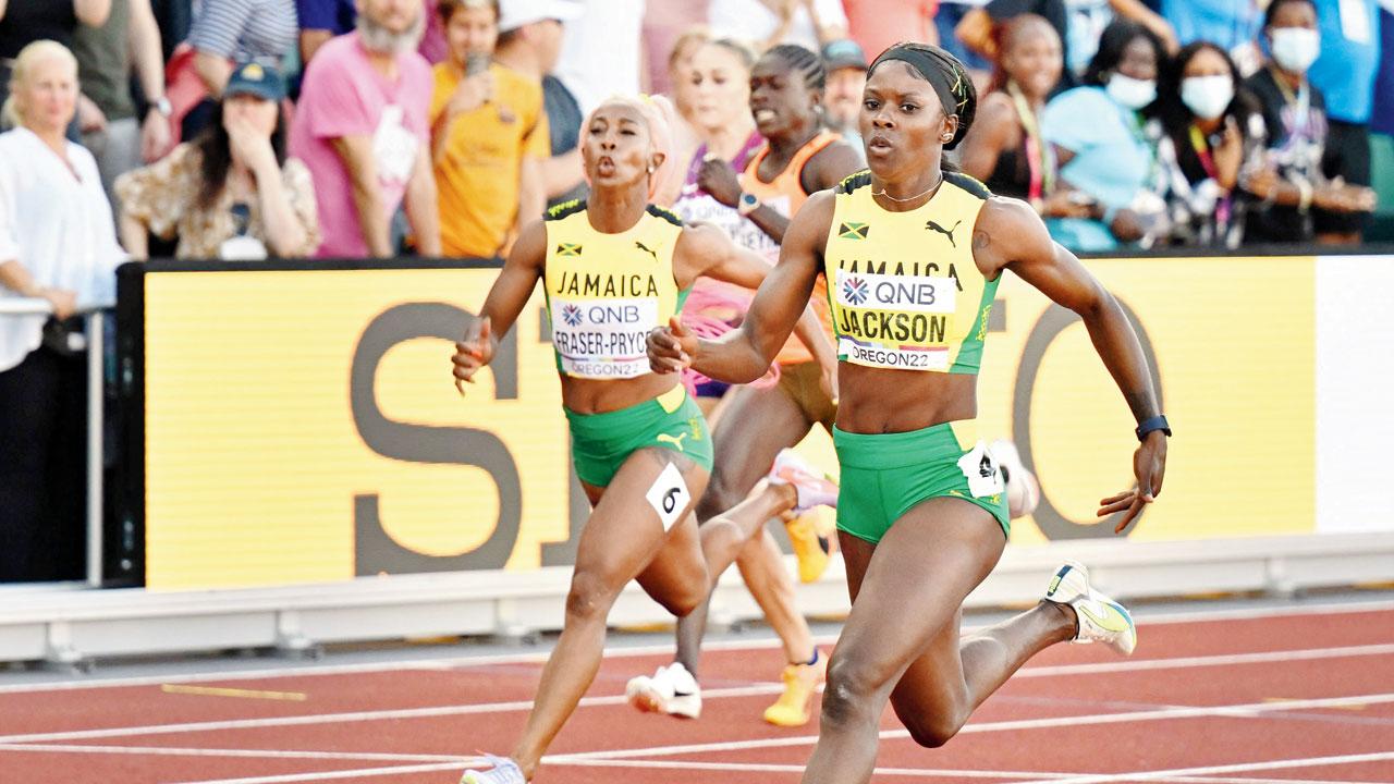 Jamaica’s Shericka Jackson (right) pips compatriot Shelly-Ann Fraser-Pryce (left) to win the 200m final. Pic/AFP
