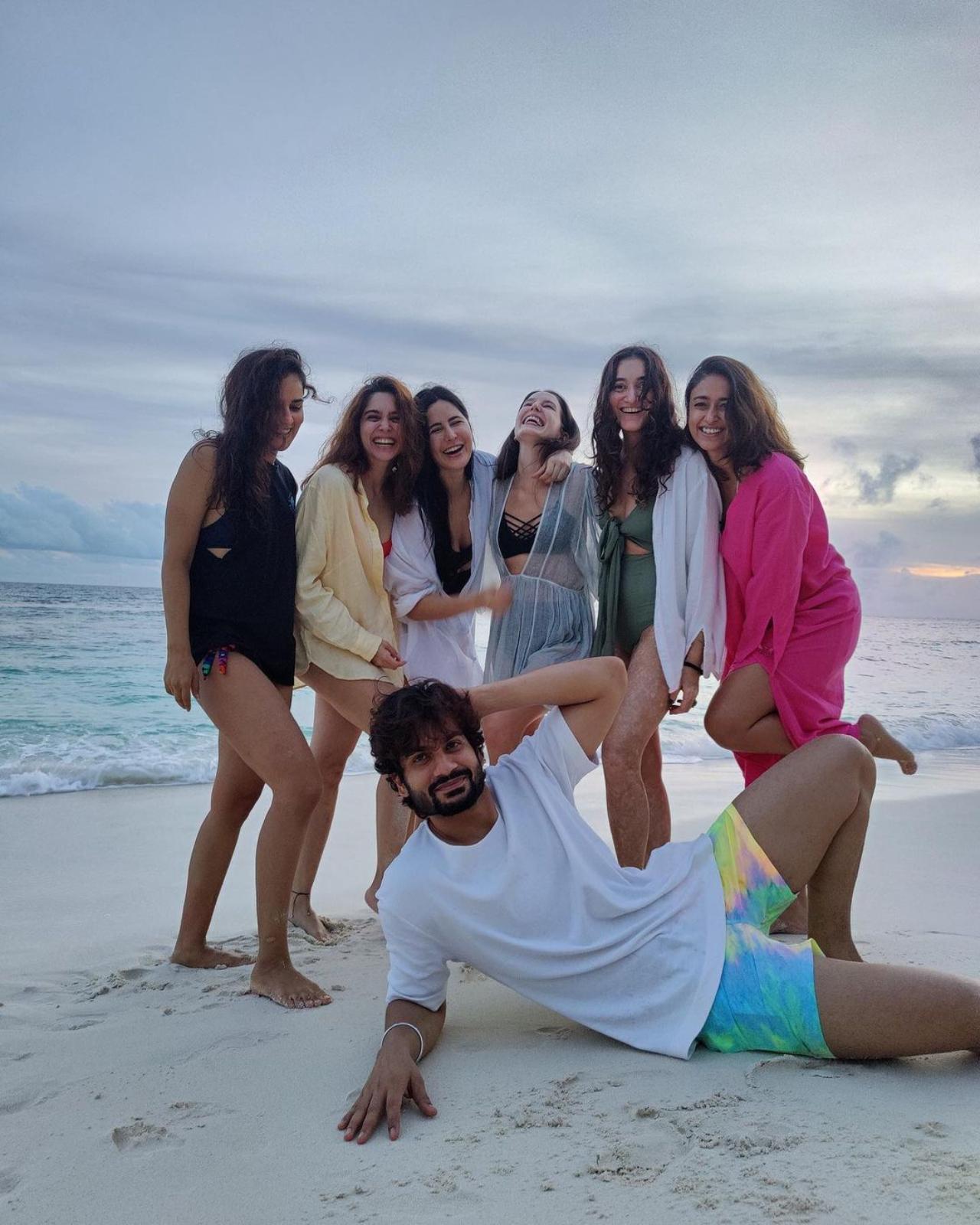 Katrina also shared a picture of Sunny Kaushal posing with her girl gang. Dressed in a white T-shirt and blue shorts, the 'Shiddat' star lied on the sand in front of the ladies