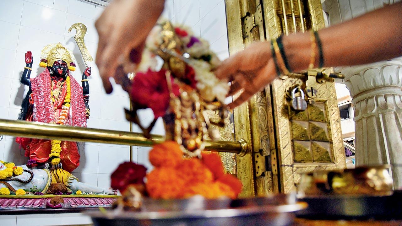 Devotees pray at the Kashi Aai or Kaali Mata temple in Thane East last Friday. Pic/Sameer Markande