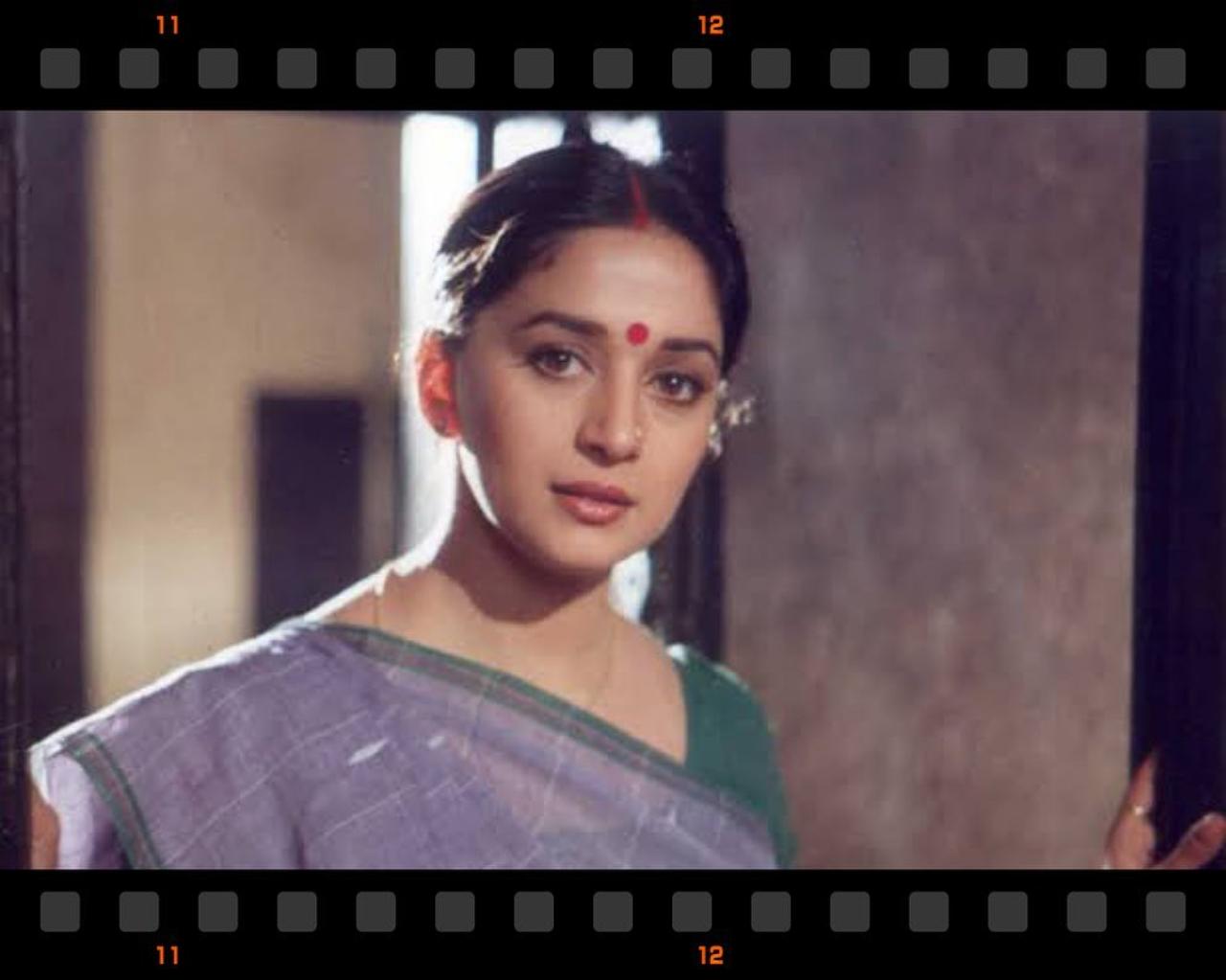 Sharing some stills from the film on its 25th anniversary, Madhuri wrote, 