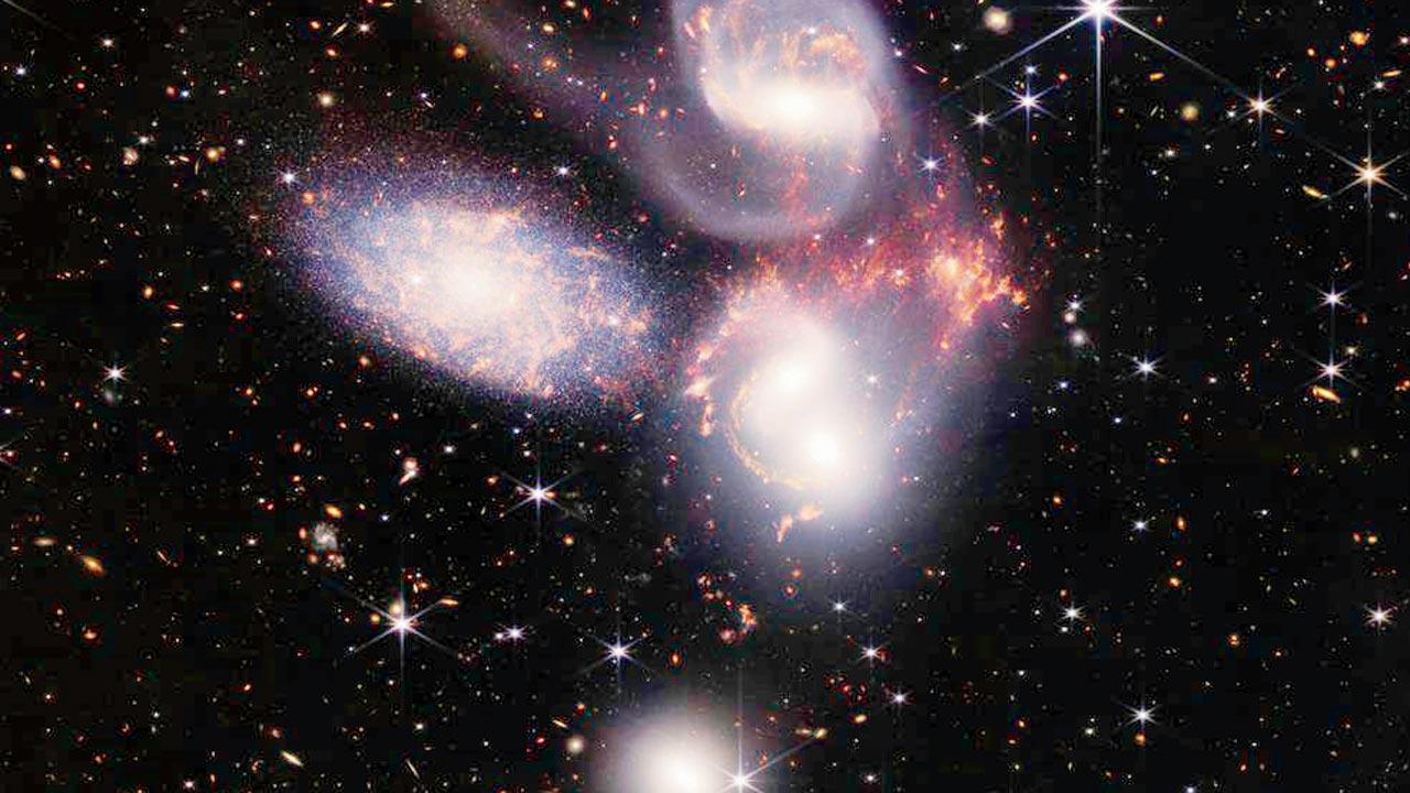Stephan’s Quintet, a visual grouping of five galaxies. This enormous mosaic is Webb’s largest image to date, covering about one-fifth of the Moon’s diameter. It contains over 150 million pixels and is constructed from almost 1,000 separate image files. The information from the Webb provides new insights into how galactic interactions may have driven galaxy evolution in the early universe