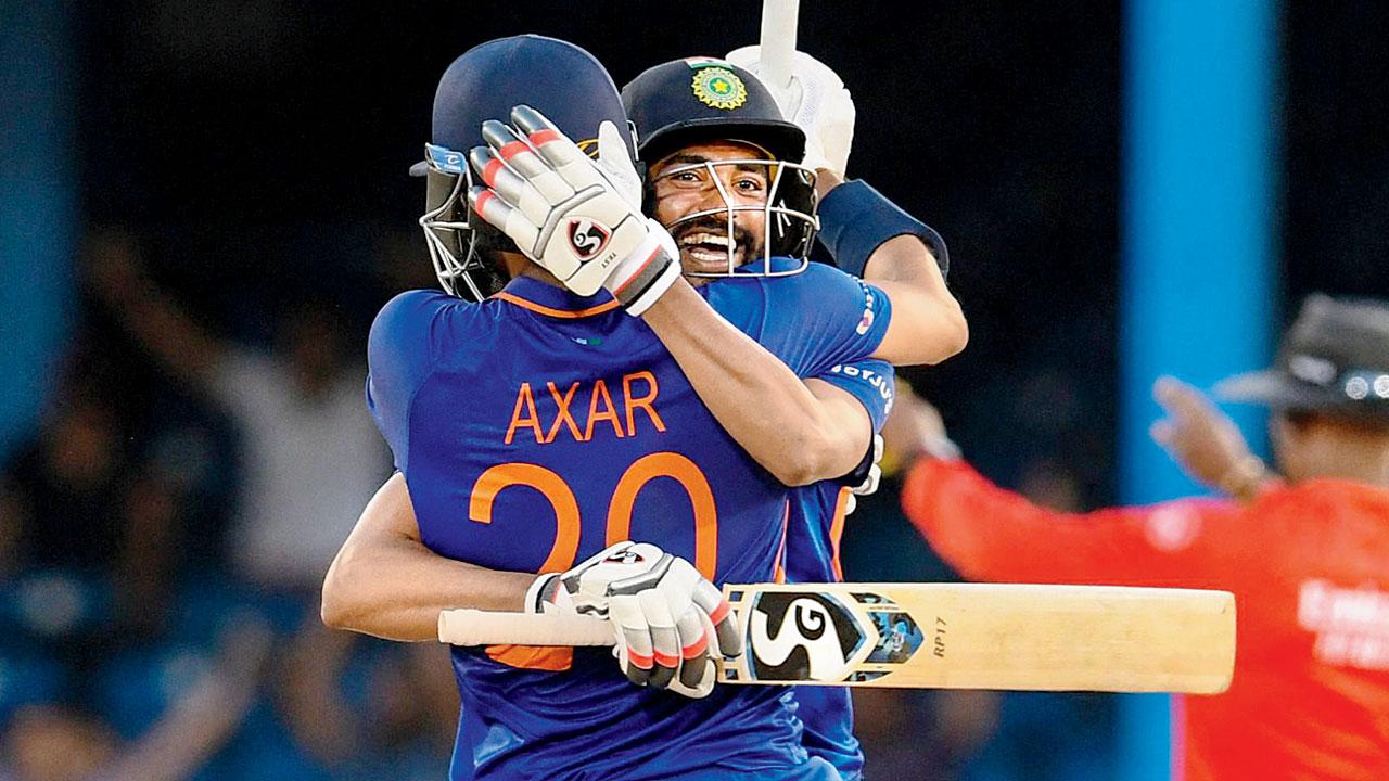 Mohammed Siraj (left) and Axar Patel celebrate India’s win