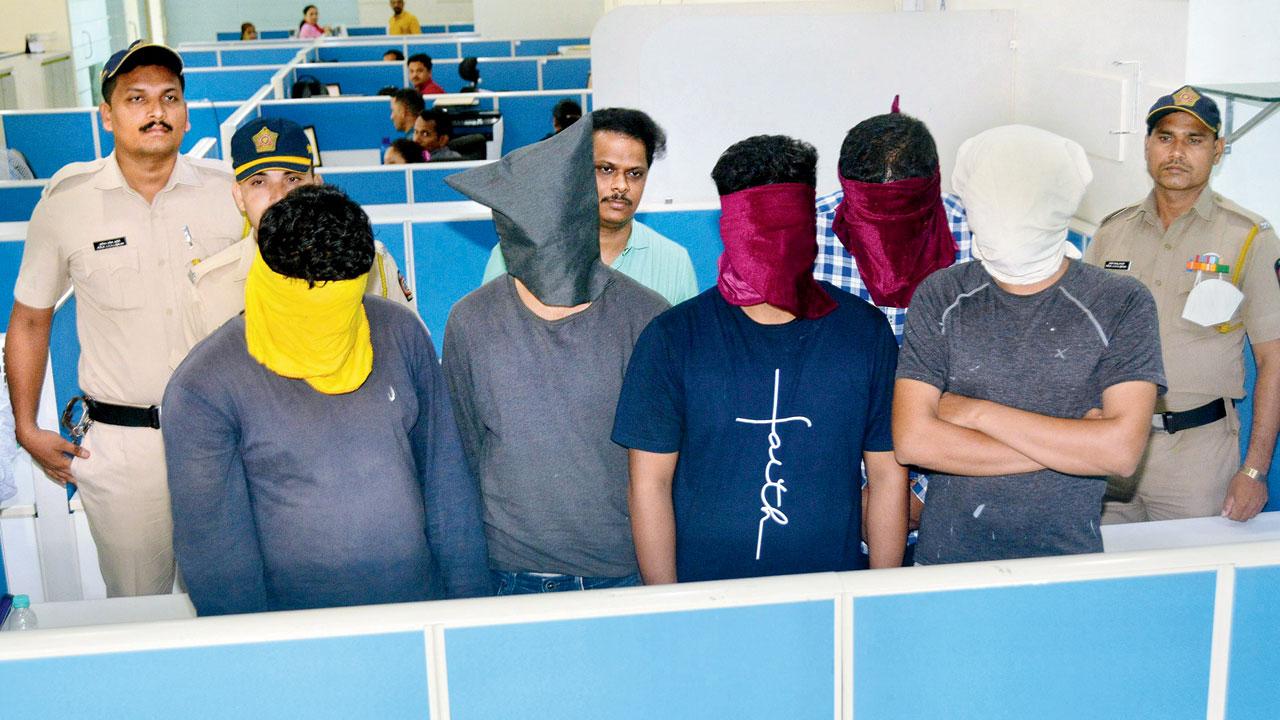 The arrested recovery agents last month. File pic