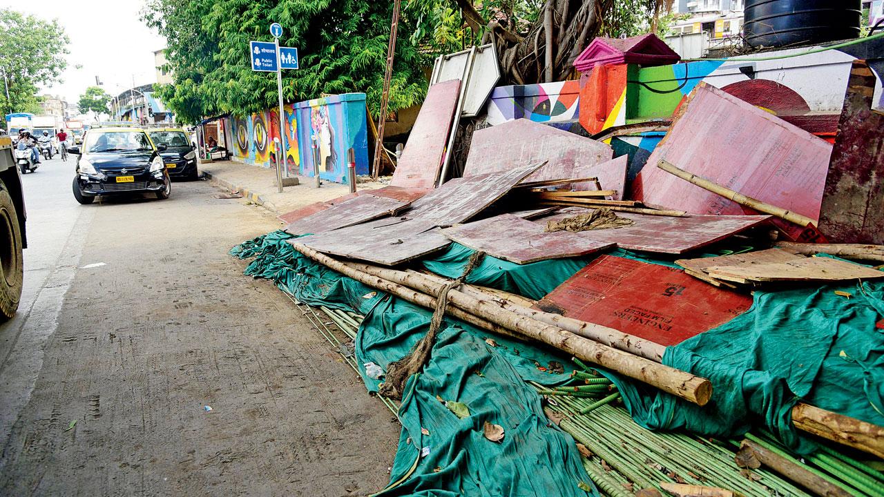 Construction material dumped on a footpath between Reay Road and Dockyard Road. Pics/Atul Kamble