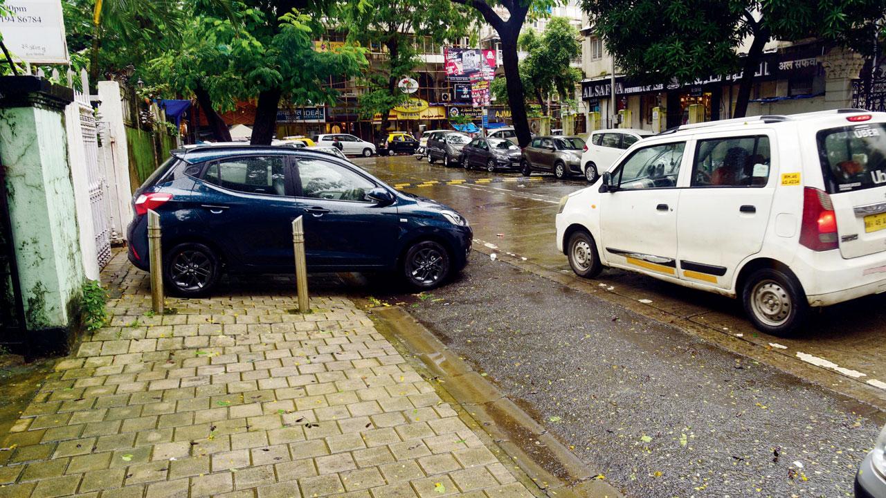 Cars leave no space for walkers on Shri Boman Kawasji Boman Behram Marg, Colaba. Pic/Pradeep Dhivar