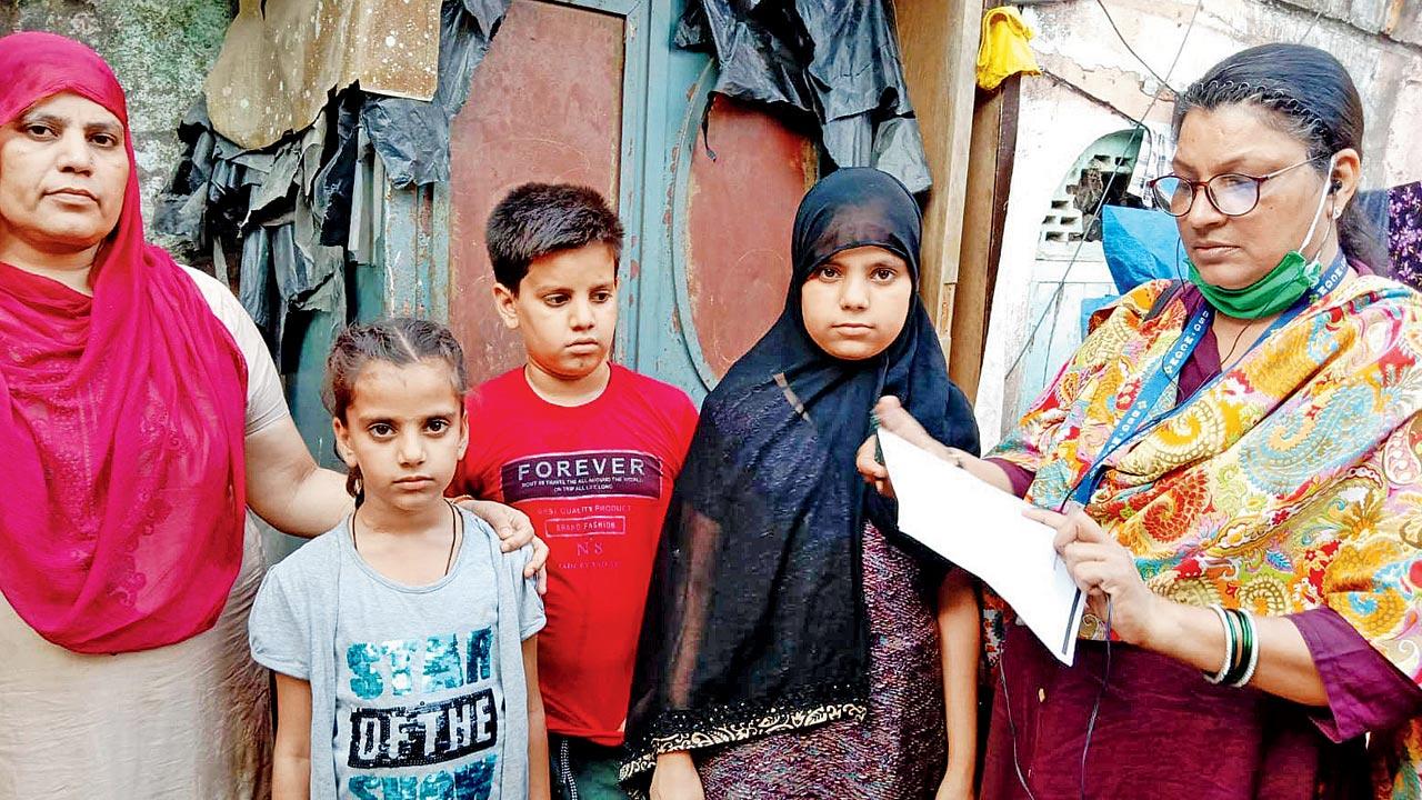 BMC school teacher Zareena Parkar during a visit to a slum near her school, encouraging parents to re-admit their children. Parkar requested local mosque management committees to make announcements after Friday sermons, urging parents to send their children back to school