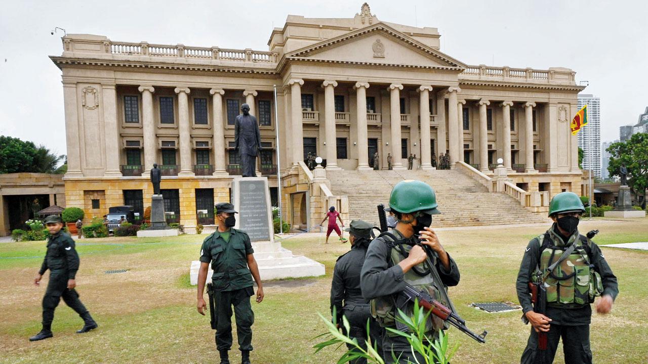 Security personnel stand guard outside the Sri Lankan Presidential Secretariat building in Colombo on Friday