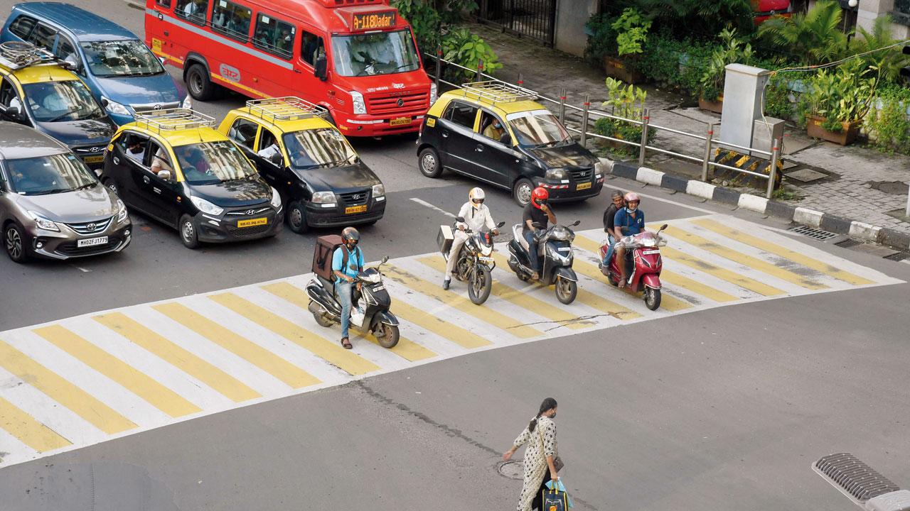 Two-wheelers occupy a zebra crossing, at Ravindra Natya Mandir, Prabhadevi, on September 20, 2021. Pic/Ashish Raje