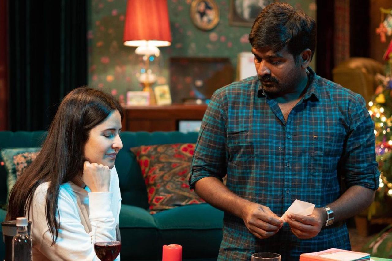 The other two pictures are candid shots of her having a discussion with co-star Vijay Sethupathi