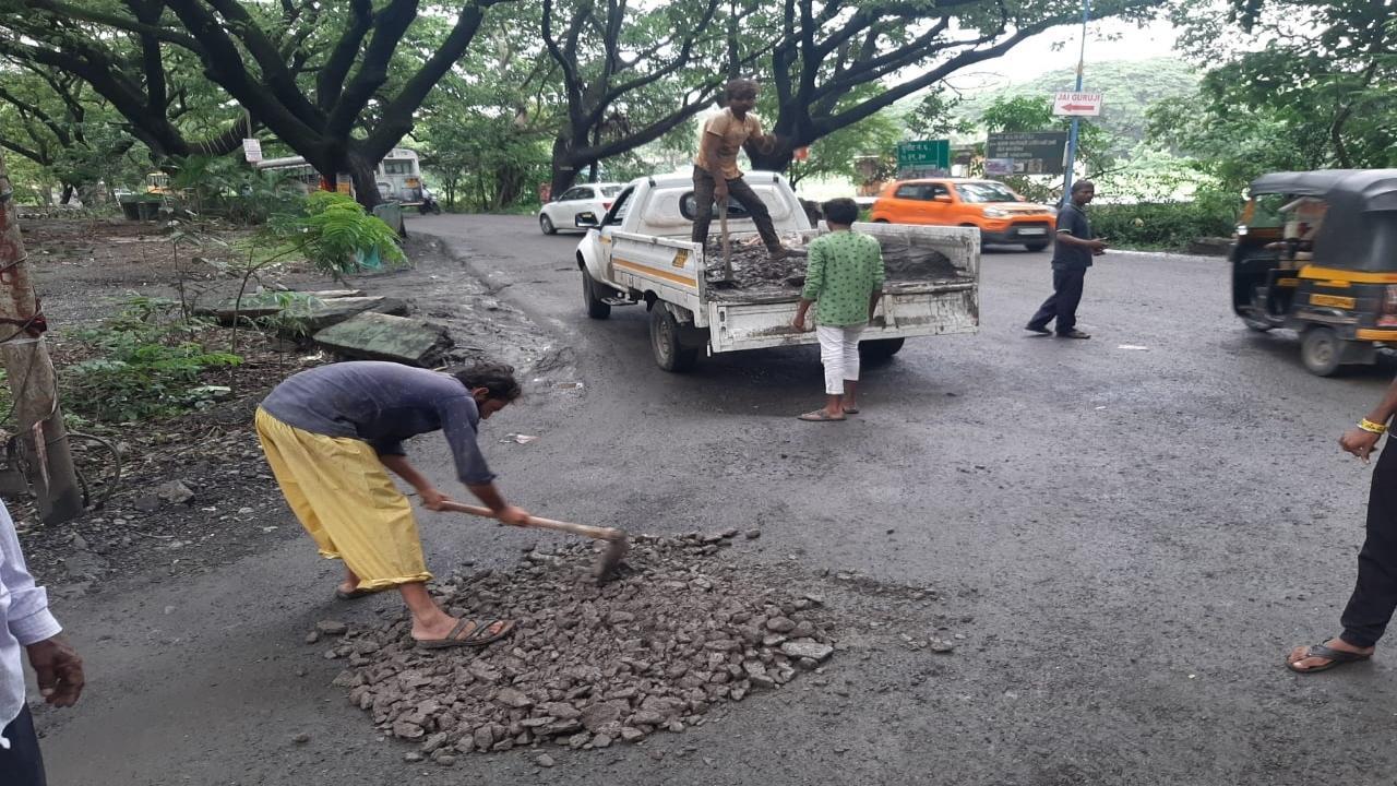 IN PHOTOS: BMC workers fill potholes amid heavy rains in Mumbai