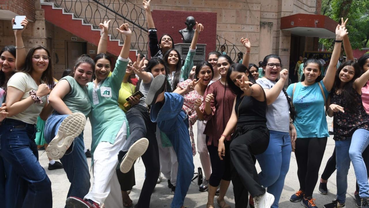 Students at  St. Thomas Girls Senior Secondary School celebrate after the announcement of Class 10th exam results in New Delhi. Pic/Pallav Paliwal