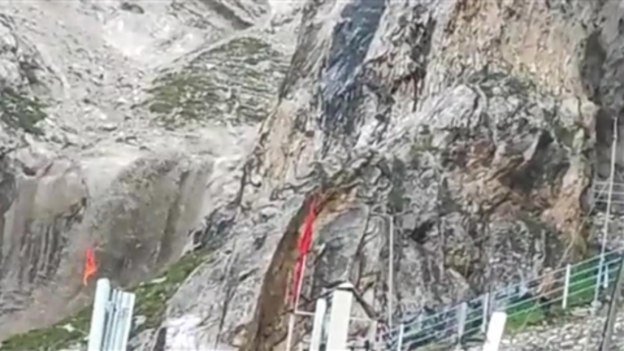 Water flows down from the mountain following a cloudburst that hit near the base camp of Amarnath shrine. Pic/PTI