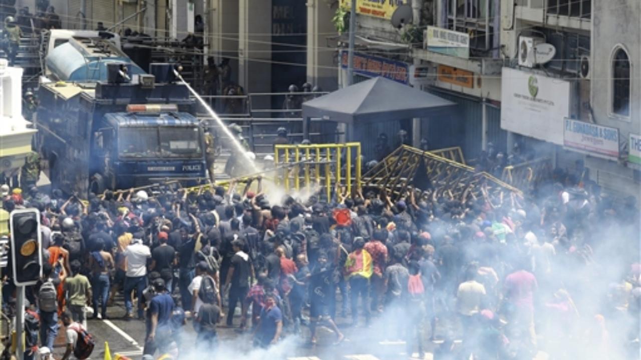 Police use water canon and tear gas to disperse the protesters, Sri Lanka. Pic/PTI