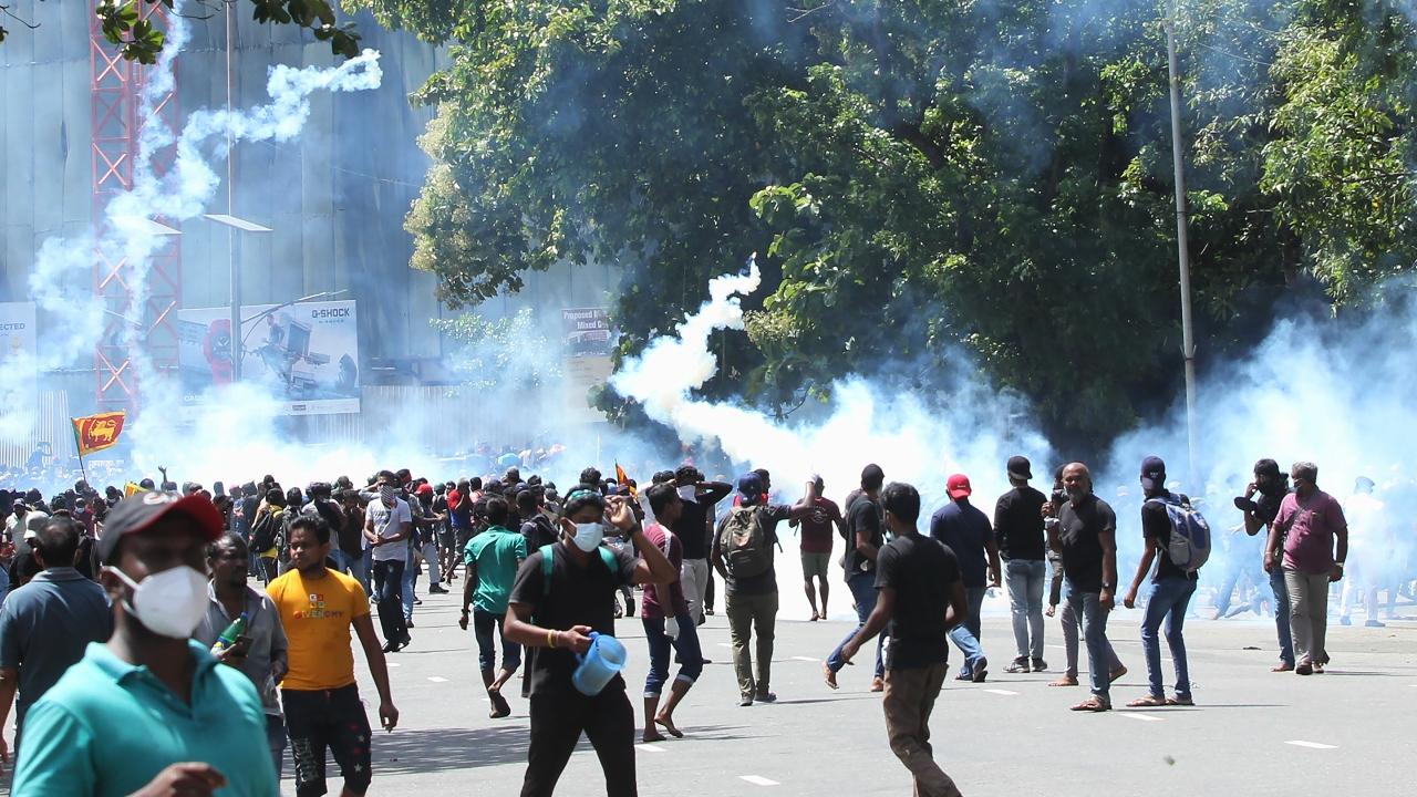 Police use tear gas to dispers protestors demanding the resignation of Sri Lanka's President Gotabaya Rajapaksa in Colombo. Pic/AFP