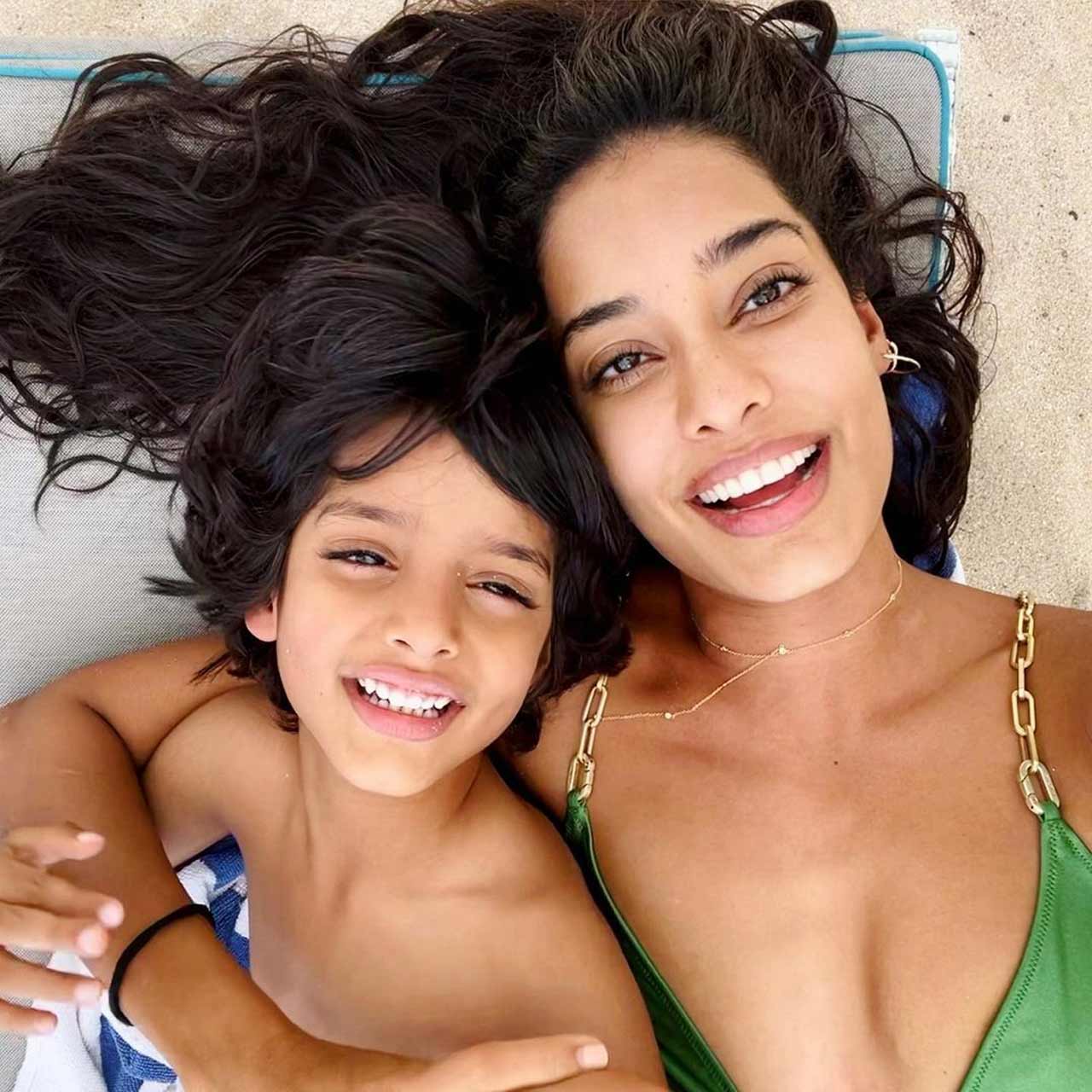 Another series of photos saw Lisa Haydon in a green bikini with her son Zack. 