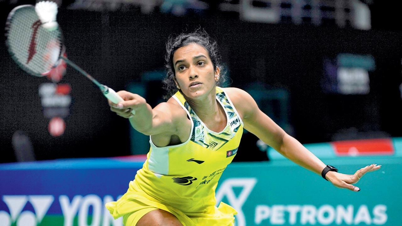 PV Sindhu returns to Phittayaporn Chaiwan during their second round match at the Bukit Jalil Indoor Stadium in Kuala Lumpur. Pic/AP, PTI