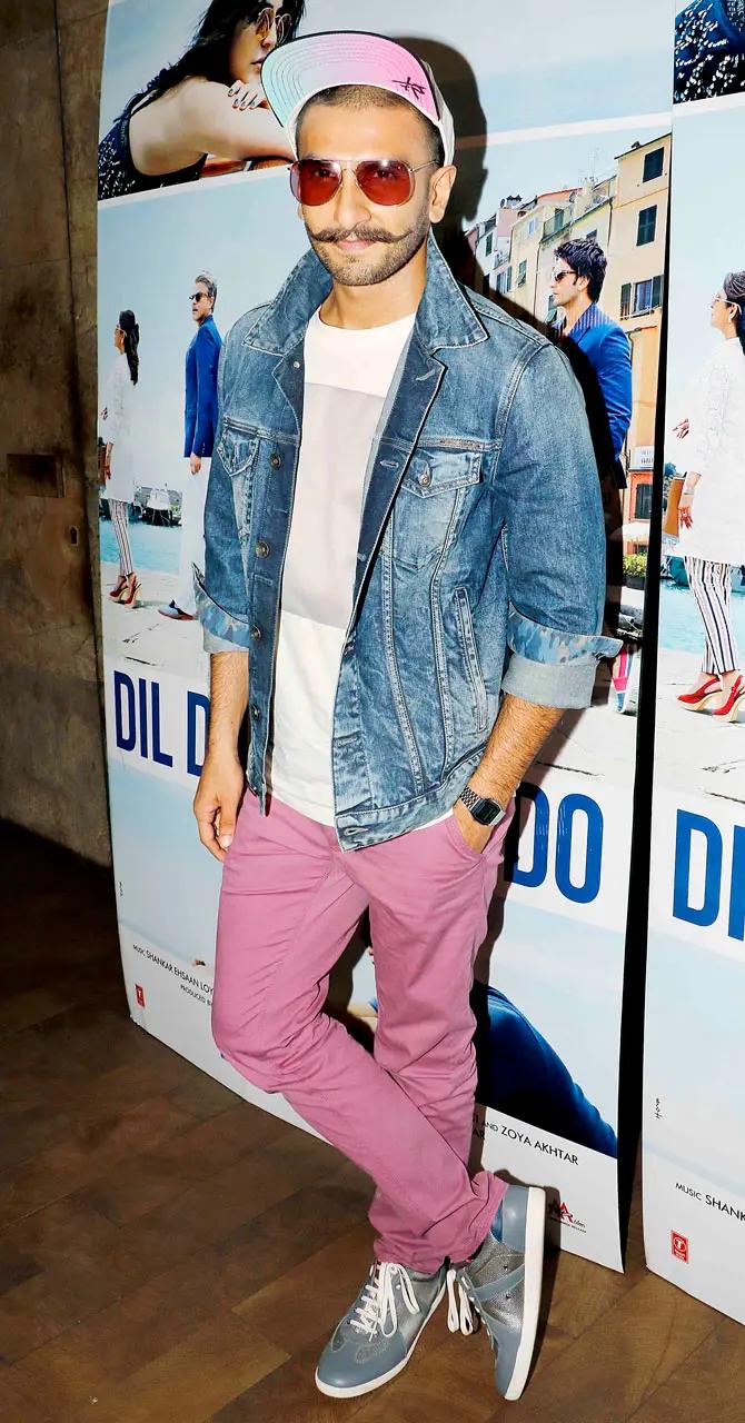 Magenta-shade trousers for men? Yes, Ranveer Singh can carry that off. And he did exactly that at a screening of a film, pairing it with a denim jacket, blue shoes and a white cap