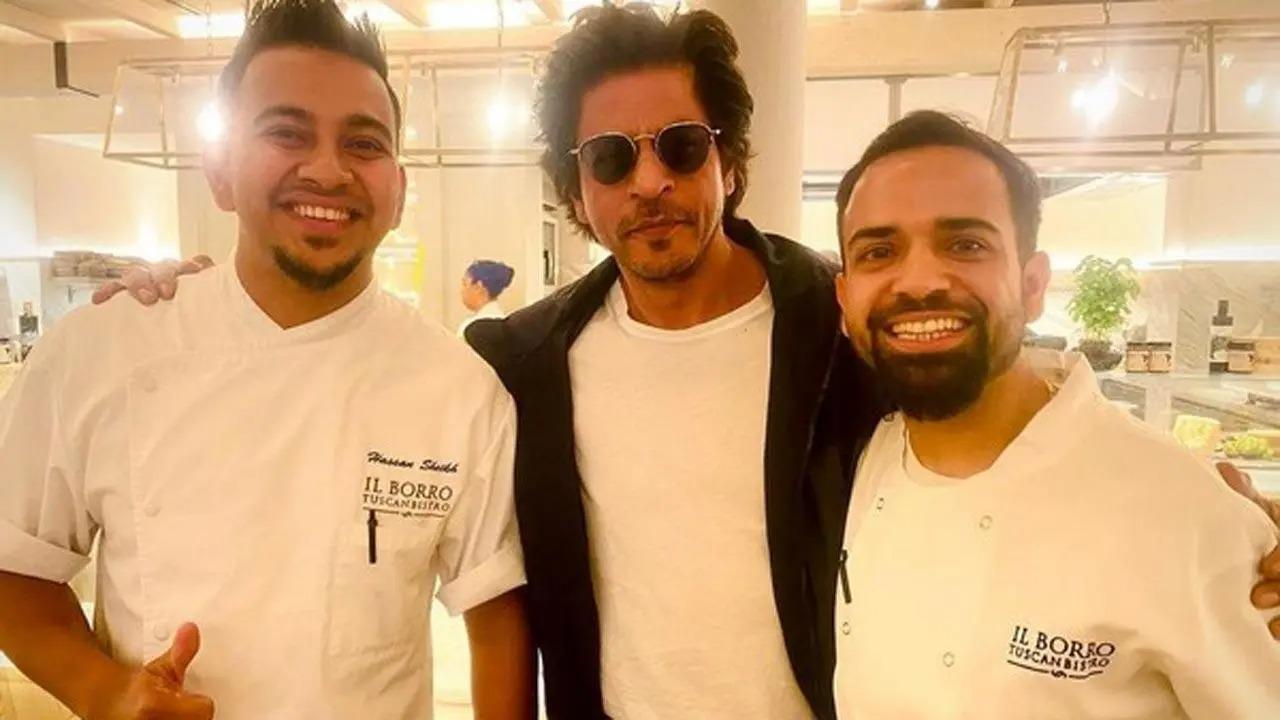 In the photo, SRK is seen posing alongside the two chefs from the Italian restaurant 'II Borro'. As far as the actor's appearance is concerned, he kept it casual in a plain white T-shirt layered under a cool black jacket. Read full story here