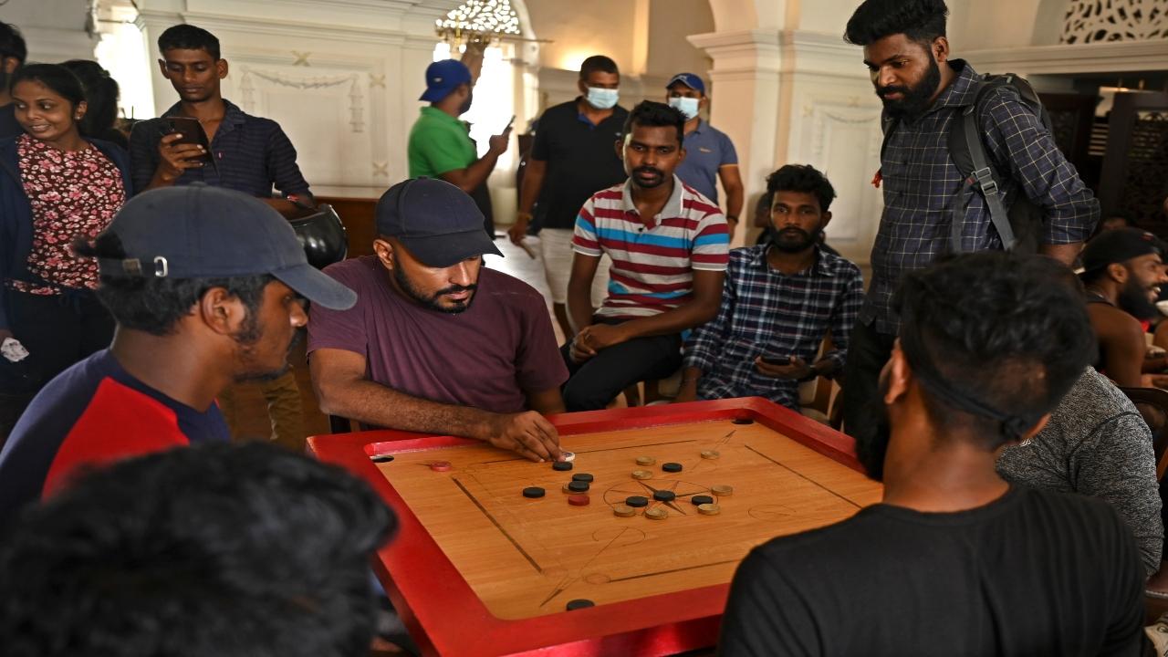 People play carrom inside the official residence of Sri Lanka's Prime Minister, in Colombo