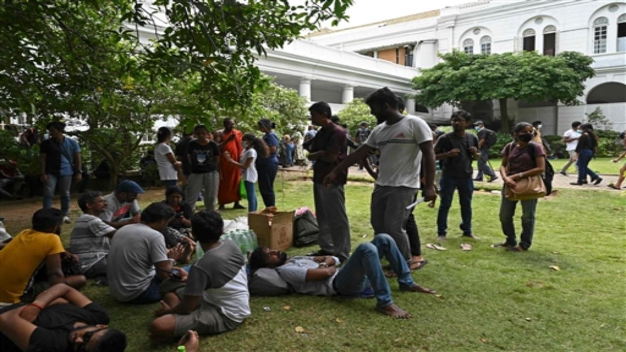 People crowd inside the premises of Sri Lanka's presidential palace