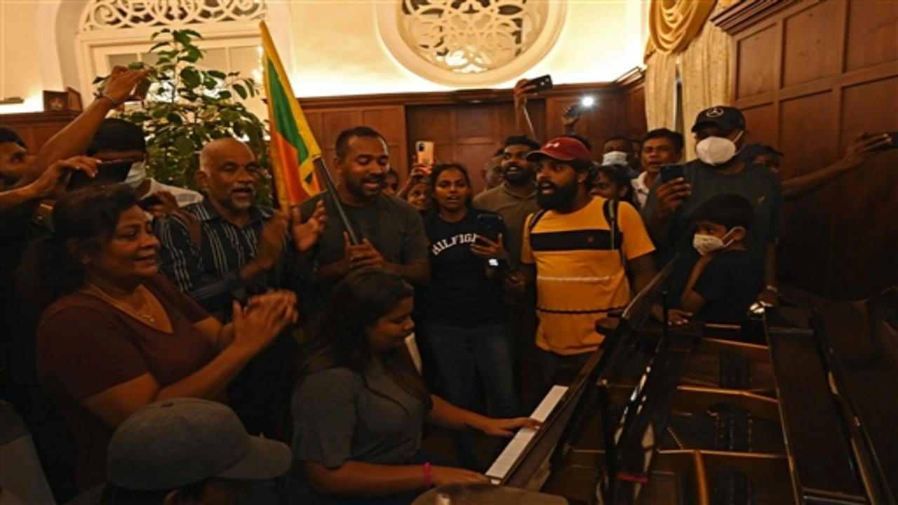 A woman plays a piano inside the Sri Lanka's presidential palace