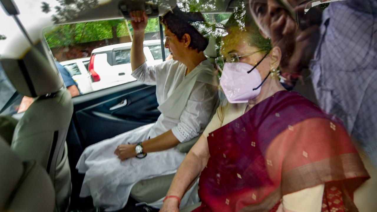 Congress President Sonia Gandhi with party General Secretary Priyanka Gandhi arrives to appear before the Enforcement Directorate for questioning. Pic/PTI