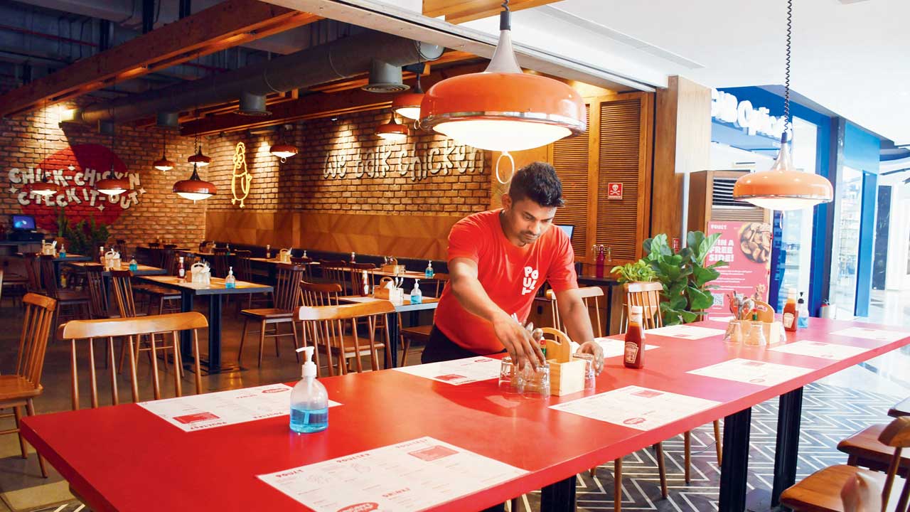 Bright red interiors of Poult brings in a fastfood chain vibe. Pics/Ashish Raje