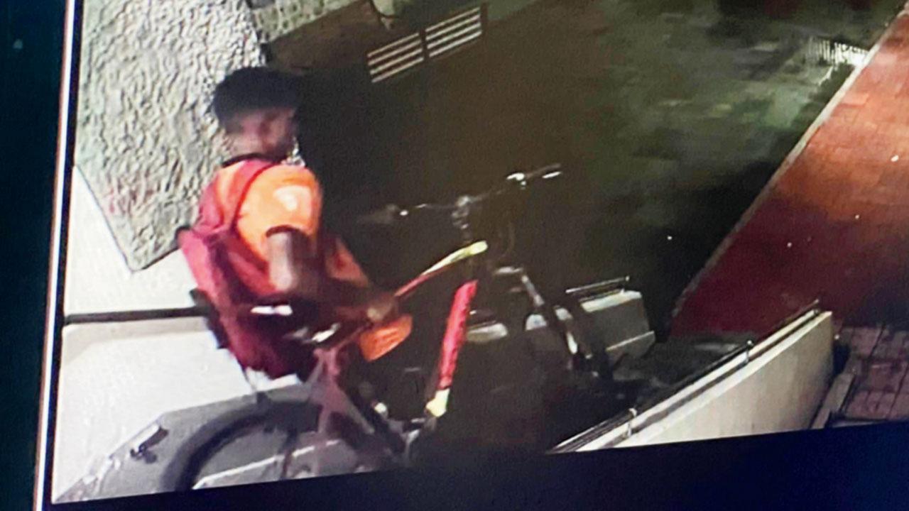 The delivery boy with the girl’s cycle, caught on a CCTV camera