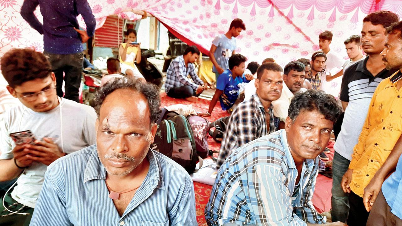 Affected residents at a makeshift camp after the mishap