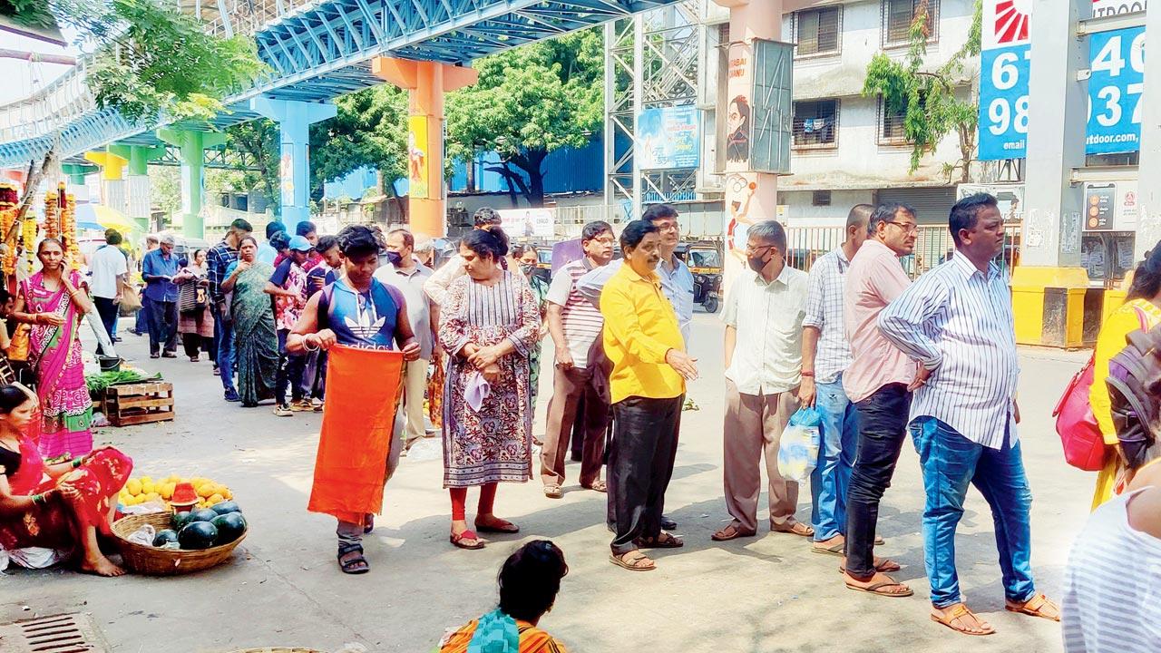 Mask is missing as commuters wait for a BEST bus in Borivali on Sunday. Pic/Nimesh Dave