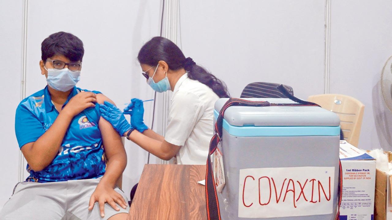 A teenage boy is jabbed with a dose of Covaxin, in Mumbai. Pic/AFP