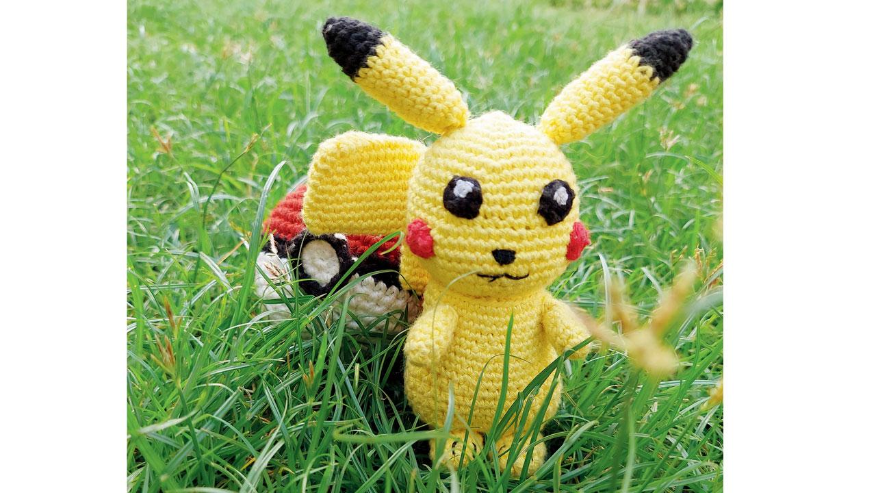 A crocheted Pikachu and pokeball