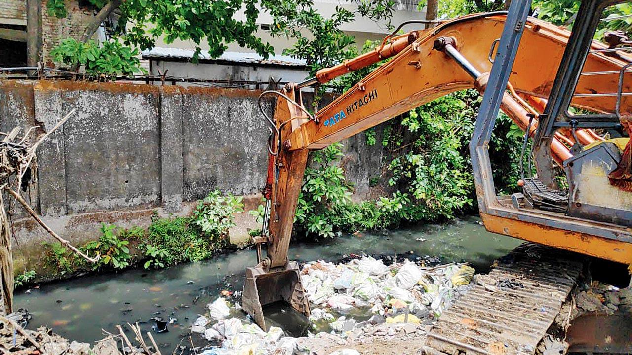 A nullah being cleaned of filth on Central Railway