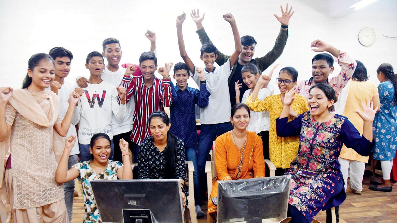 Students and teachers celebrate after the results at Sankalp English School, Thane west, on Friday. Pic/Sameer Markande