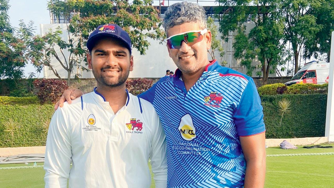Mumbai’s Suved Parkar (left) with coach Amol Muzumdar at Alur yesterday