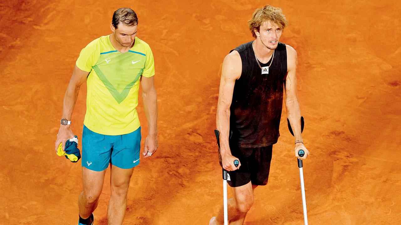 Nadal walks alongside Zverev on crutches. Pics/AFP