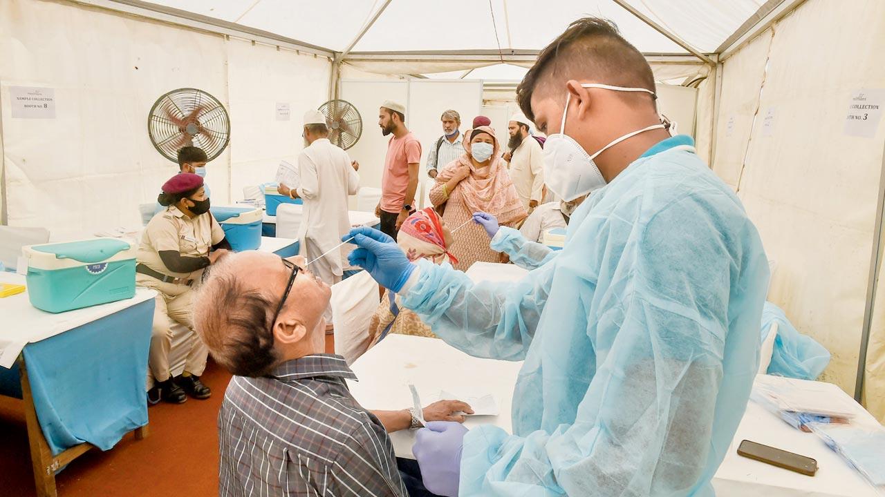 Citizens undergo COVID test before leaving for their pilgrimage to Mecca, in Delhi, on Sunday. Pic/PTI